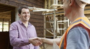 Contractor shaking hands with customer