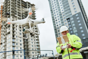 Contractor flying drone | Drones in Construction - FAA Regulations