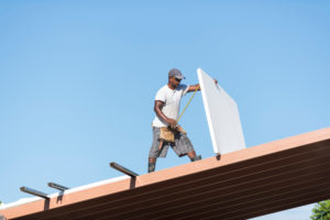 Roofers Paid on Their Jobs