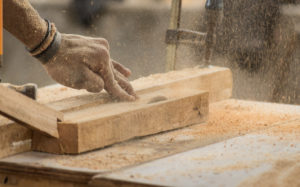 Close-up of carpenter's hands sawing wood | Nevada Conditional Progress Lien Waivers