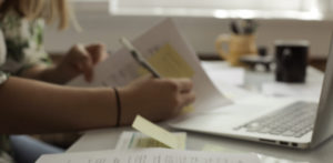 Office Administrator filing construction payment paperwork | Top factoring companies for construction contractors Office Administrator filing construction payment paperwork | Top factoring companies for construction contractors