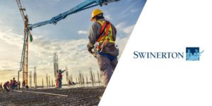 Subcontractors working on a project next to Swinerton logo