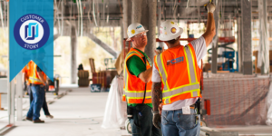 Photo of construction workers on a site with "customer story" flag