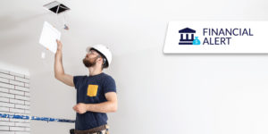 Photo of electrical contractor making in-home repair Photo of electrical contractor making in-home repair