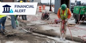 Photo of construction worker with financial alert tag