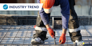 Photo of tile worker with industry trend graphic
