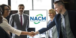 NACM logo with two professionals shaking hands NACM logo with two professionals shaking hands