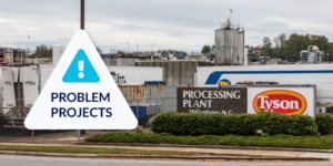 Photo of Tyson processing plant with triangle Problem Projects graphic overlaid