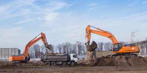 Photo of construction equipment preparing an open construction site