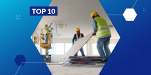 Photo of 2 contractors lifting a piece of wall into place while a third contractor in the background repairs a ceiling with a "Top 10" label
