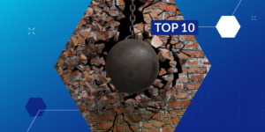 Photo of a wrecking ball breaking through a brick wall with a "Top 10" label