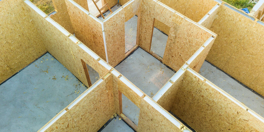 Photograph from above of Structural Insulated Panels making up a building.