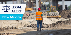Worker on construction site with Legal Alert: New Mexico label